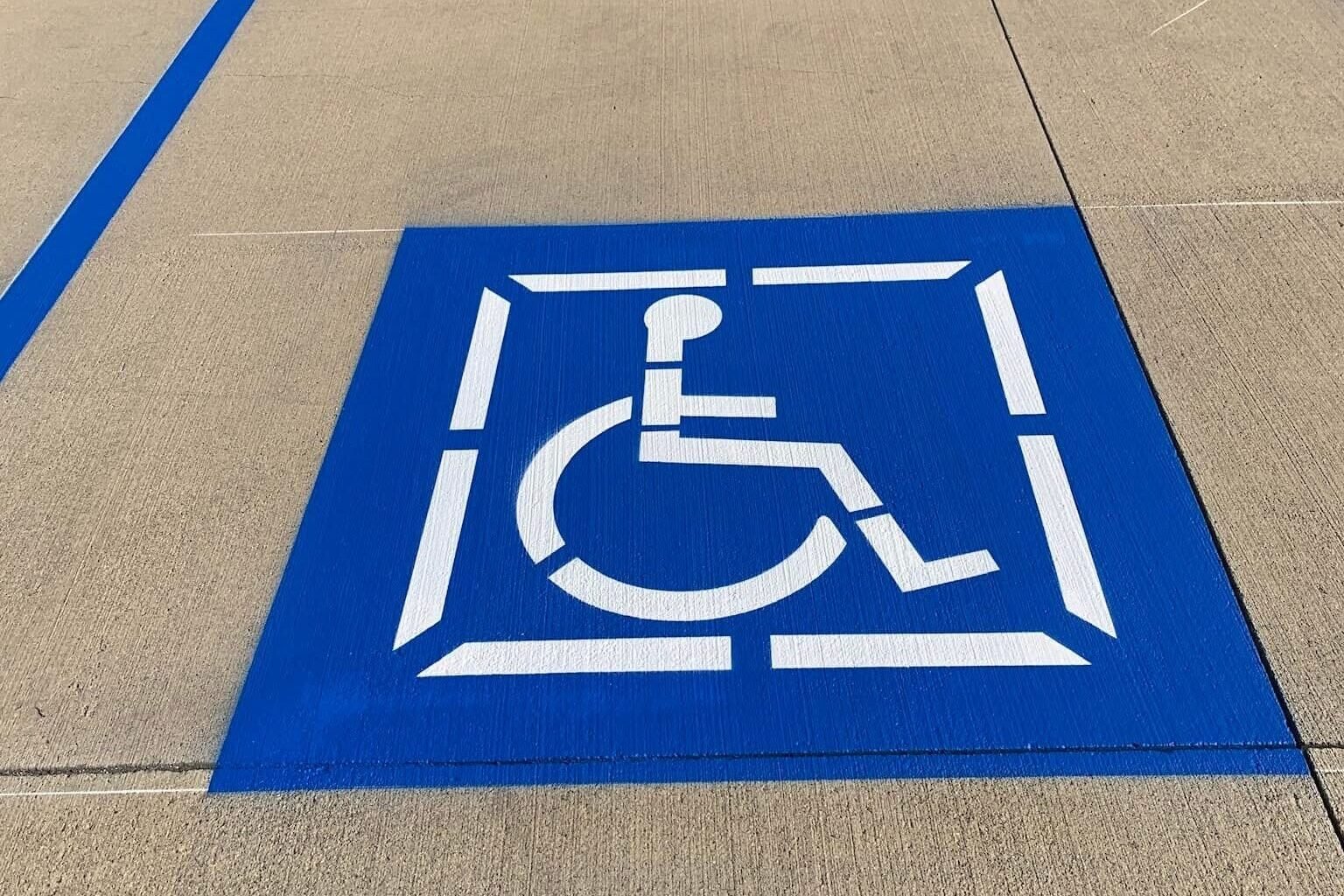 ADA-compliant handicap parking markings in a commercial parking lot in Jackson, MS.