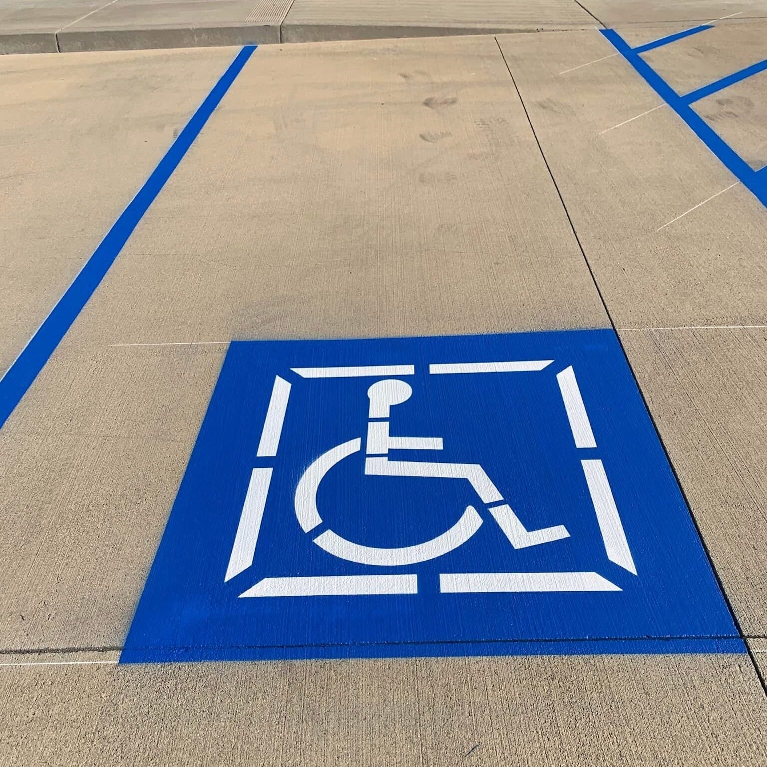 ADA-compliant handicap parking markings in a commercial parking lot in Jackson, MS.